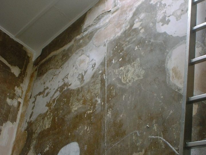 Old plaster and the line of a former staircase, exposed during the works