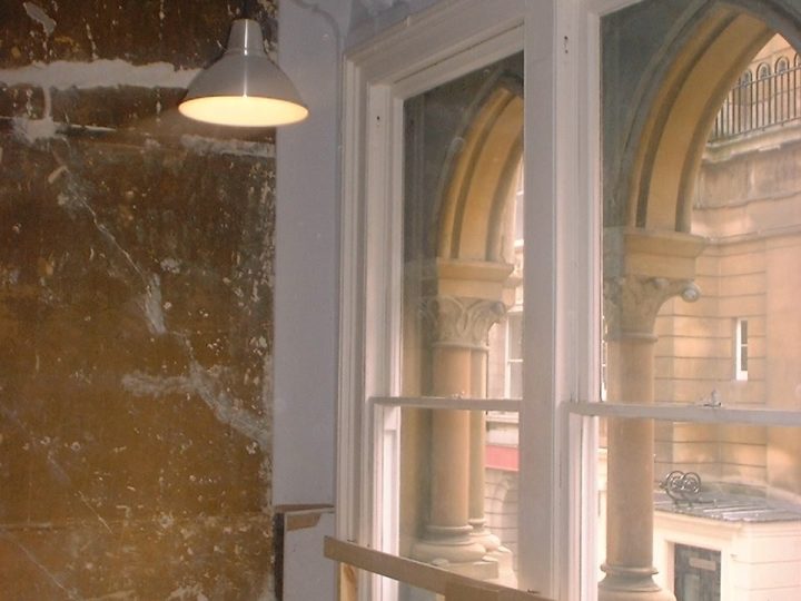 The great first-floor windows from inside, with the stone columns between the lights