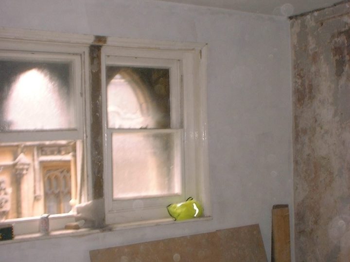 A pointed window seen from inside, newly plastered