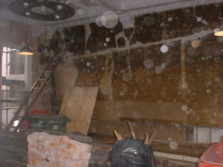 The first-floor room mid-way through the works, its old wall finishes still showing