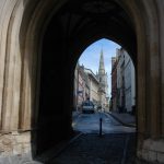 View through St John's Gate, below the tower of the Church of St John the Baptist, Bristol, looking southeast down