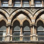 The first-floor arcade, with the words Fire, Accident, Marine, Life in its roundels